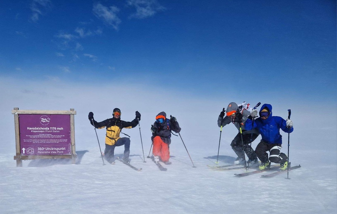 Friends standing on a vast white salt flat